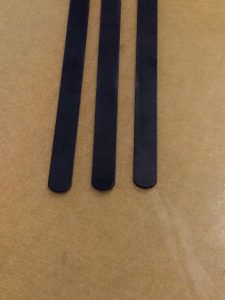 Scissor case belt with curved edges