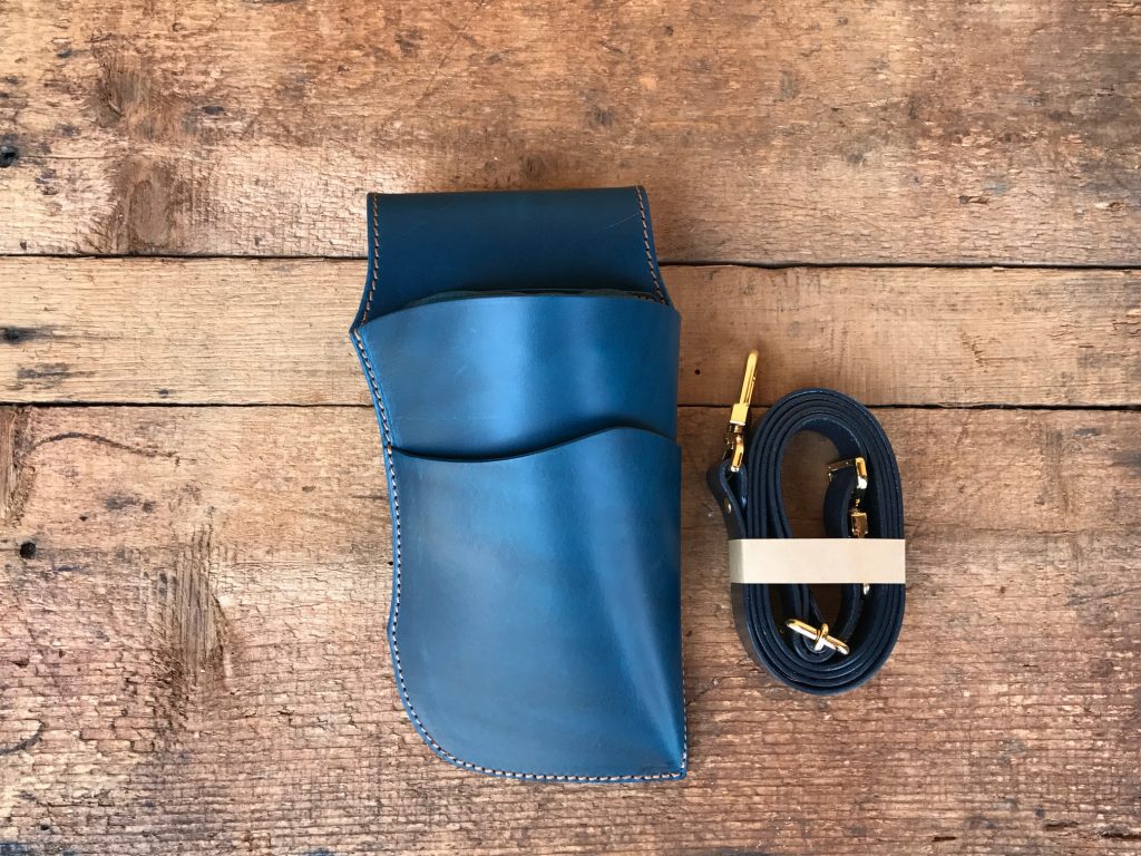 The translucent blue of the scissor case -sea- shining in natural light