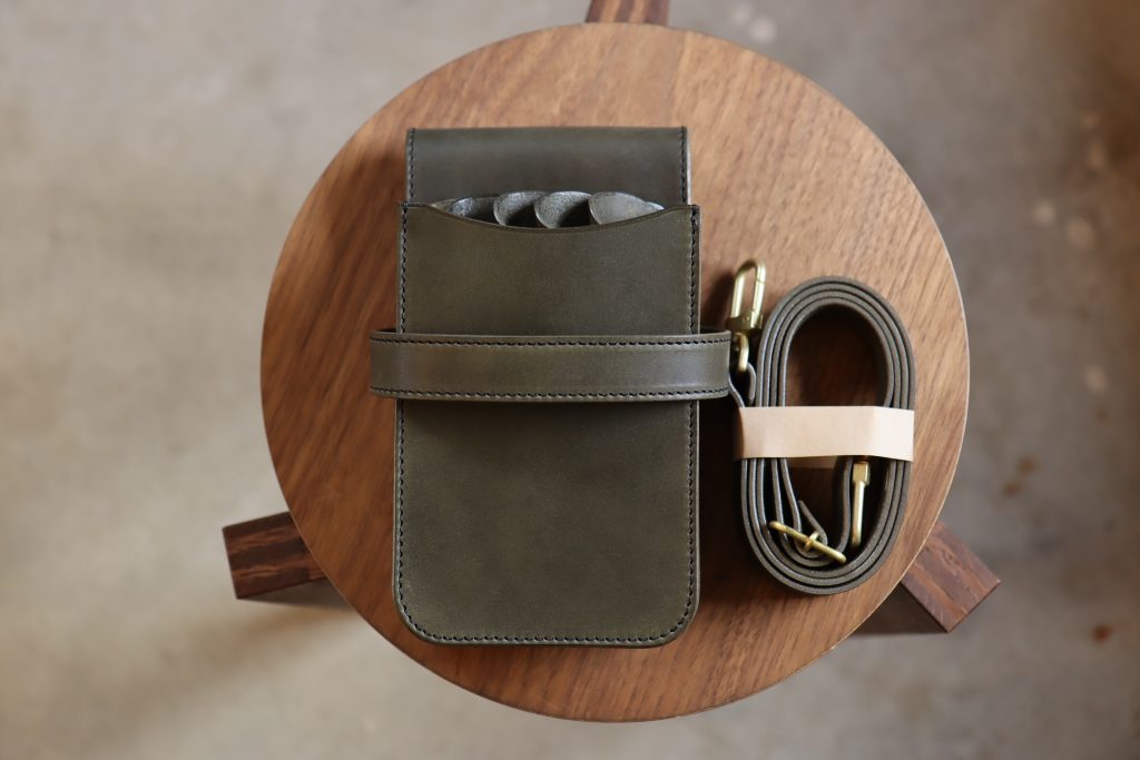 Olive leather with black stitching